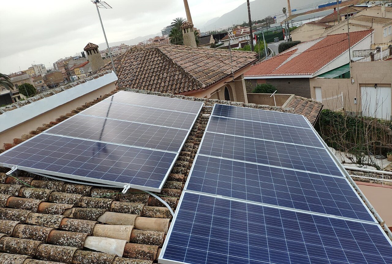 Photovoltaic modules installed on a tiled residential roof Solar modules on a tiled roof